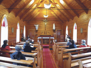 Some of the retreat group praying in the church at Motuti, interment place of Bishop Pompallier. Photo: Michael Mahoney SM.